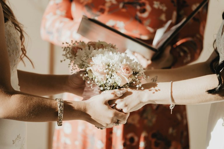 two brides getting married holding hands