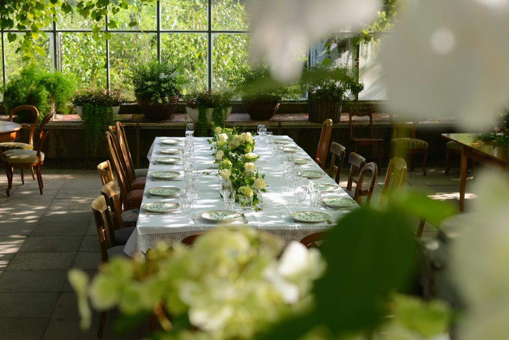 a table decorated with flowers and cuttlery